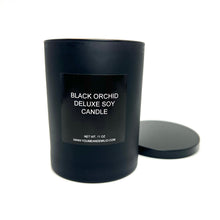 A warm glow from the Tom Ford Inspired Black Orchid Candle, enhancing an elegant ambiance with its rich fragrance.