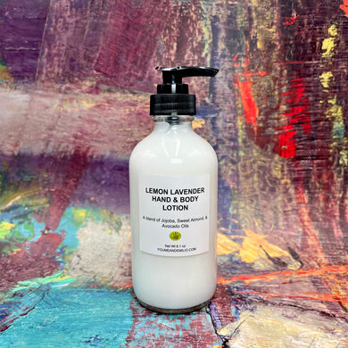 Bottle of Lemon Lavender Hand & Body Lotion with zesty lemon and lavender blossoms in the background.