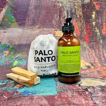 Palo Santo Hand & Body Lotion bottle with a glowing drop of lotion beside it, highlighting its deeply hydrating and nourishing properties for radiant skin.